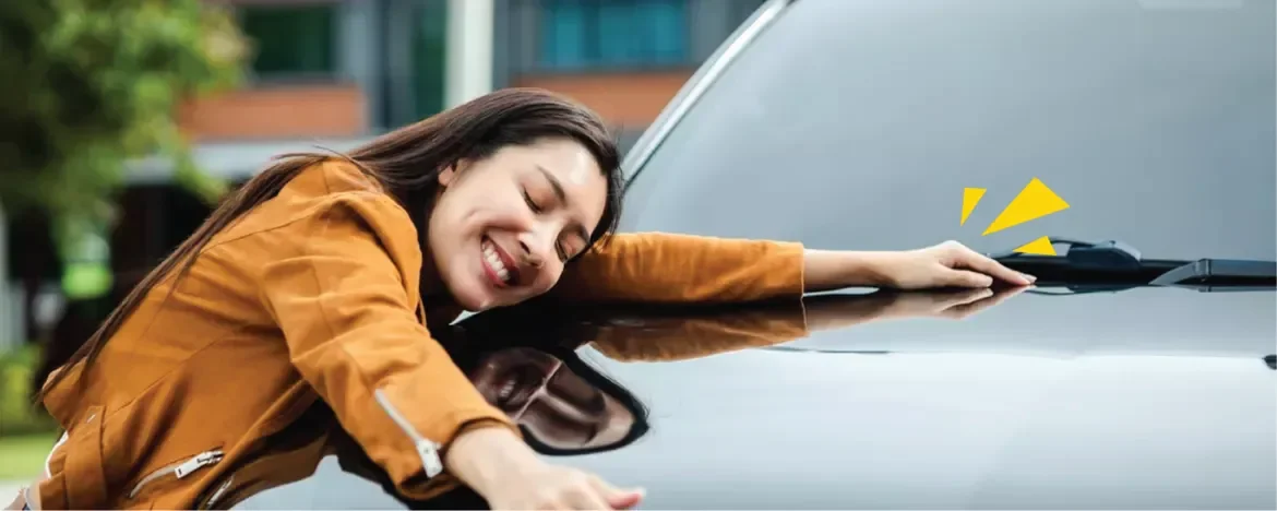 Woman hugging car