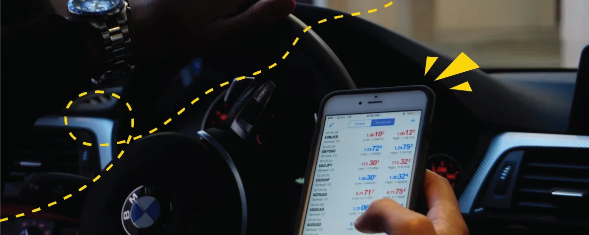 Person scrolling on a mobile phone in a car