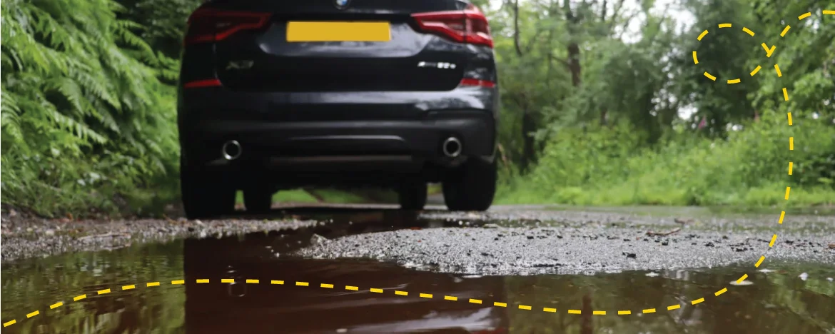 Car next to a puddle