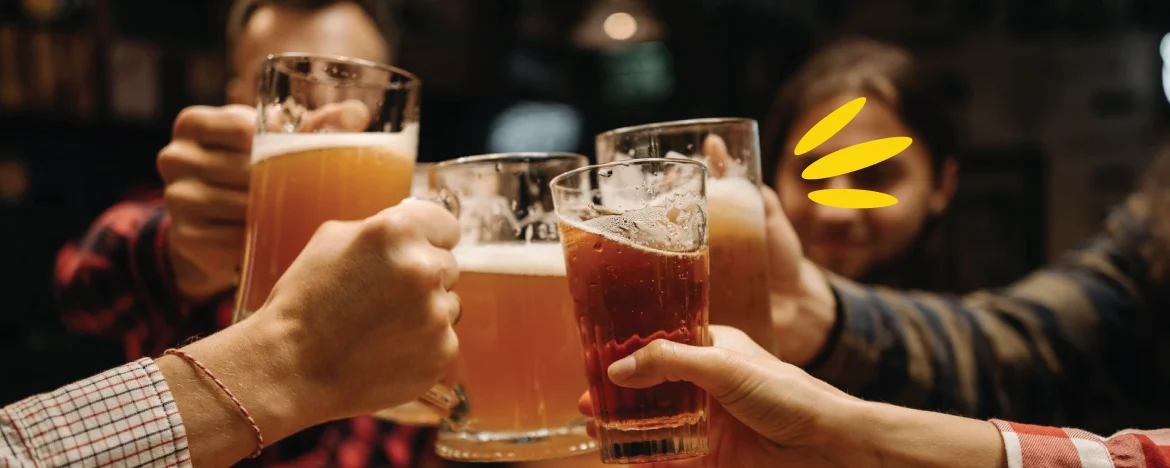 People clinking glasses of beer together