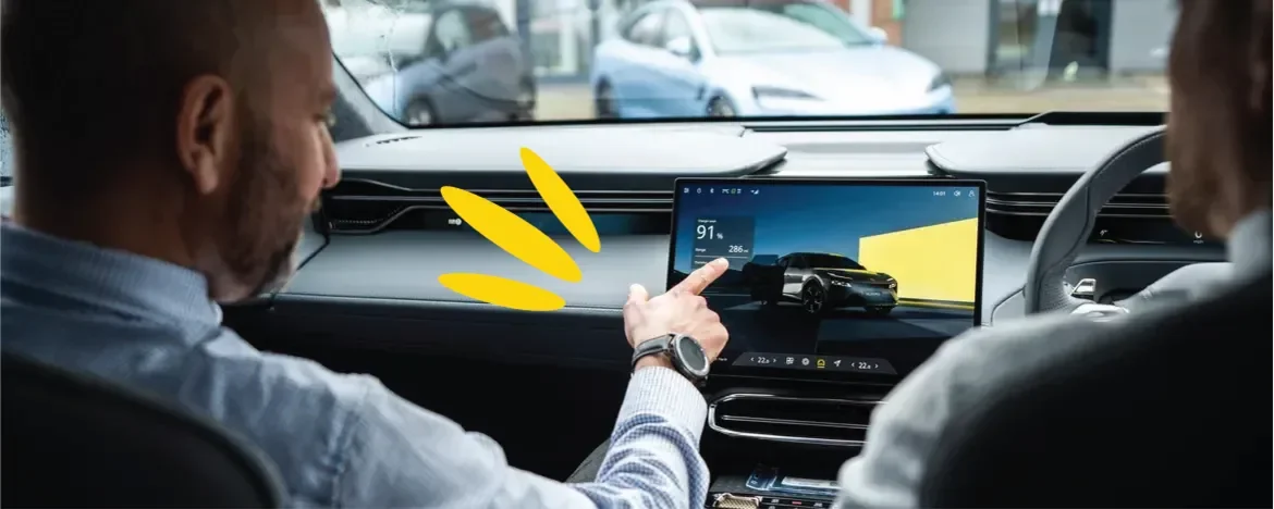 Man pointing at infotainment system