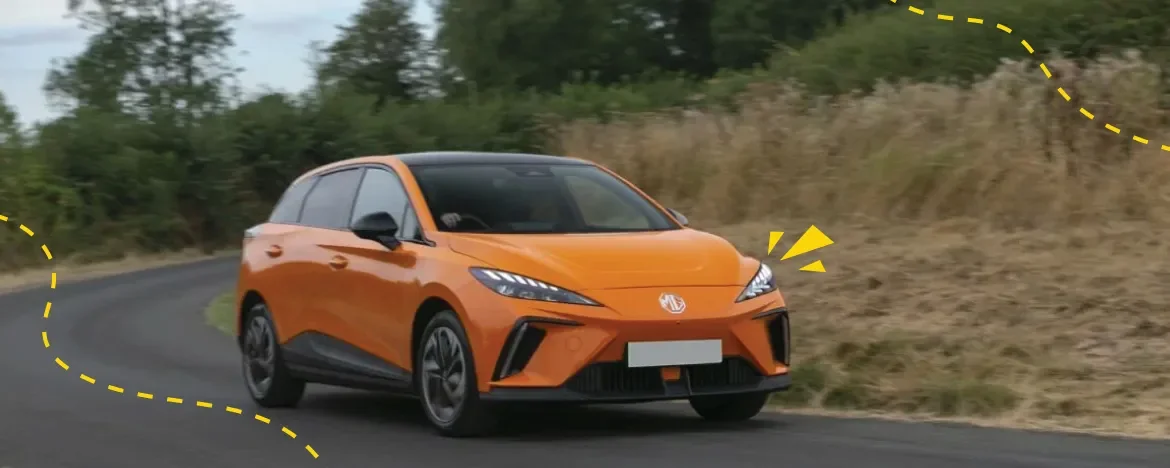 Orange MG4 on the road with yellow accents