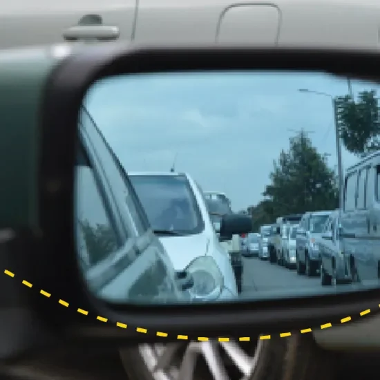 cars in a traffic jam, viewed through a wing mirror