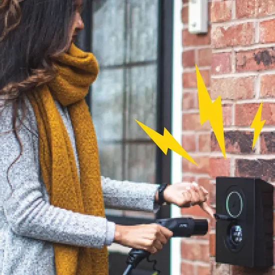 Woman using an at home EV charger