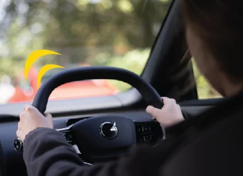 Woman driving Volvo